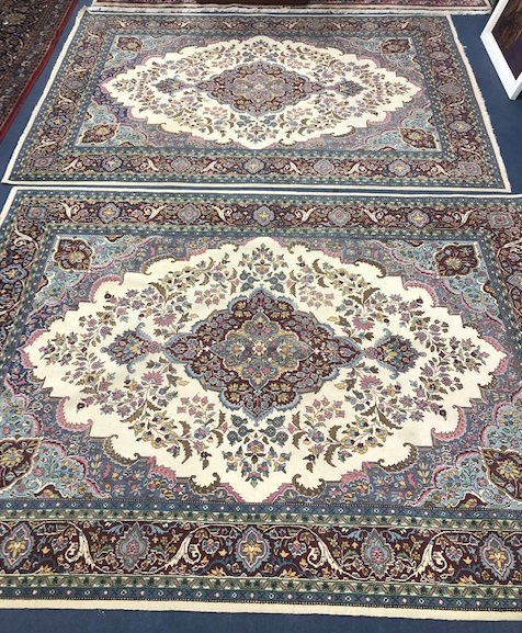 Two Persian style ivory ground rugs 220 x 154cm